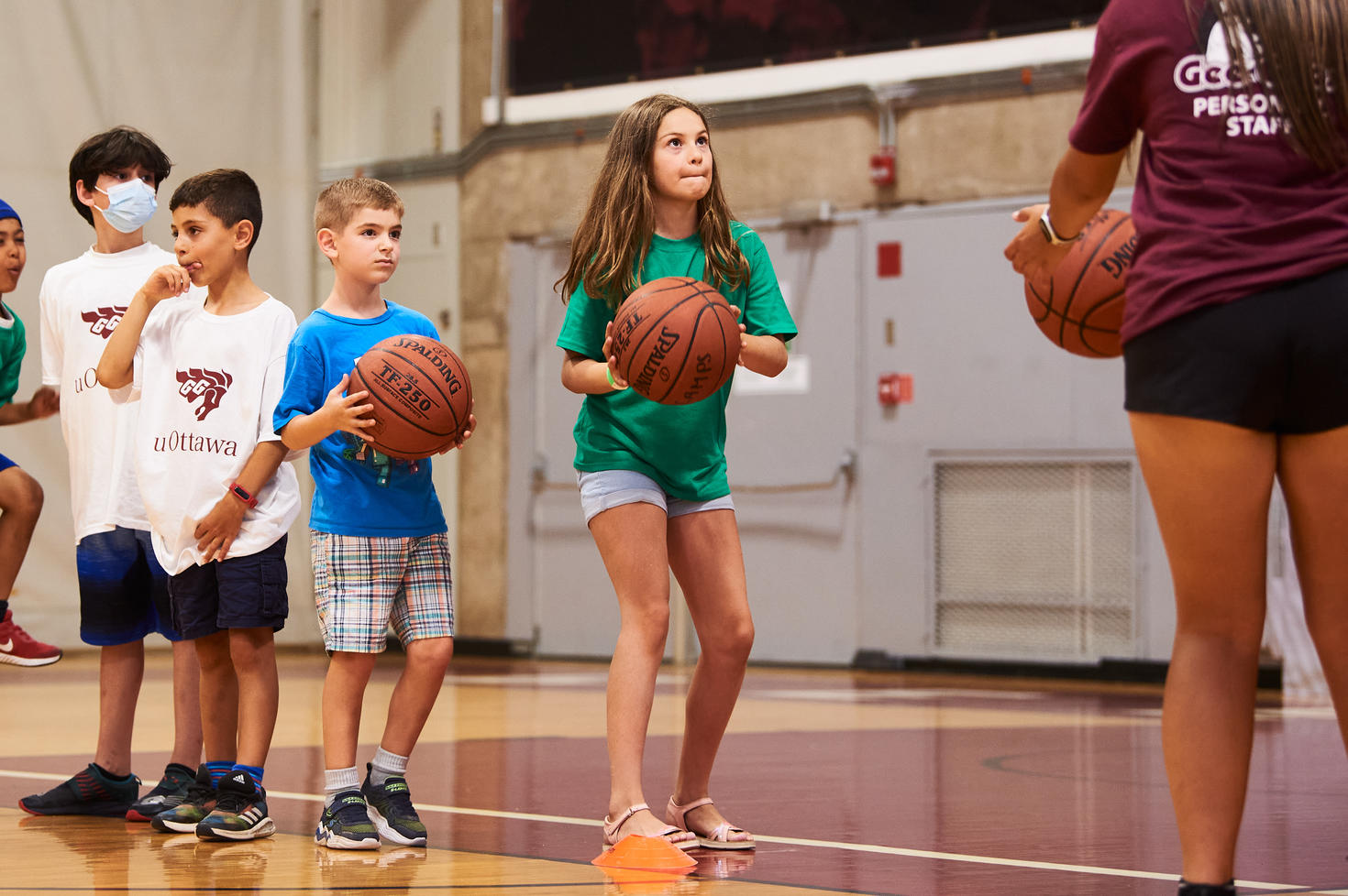 Little girl playing Basketball