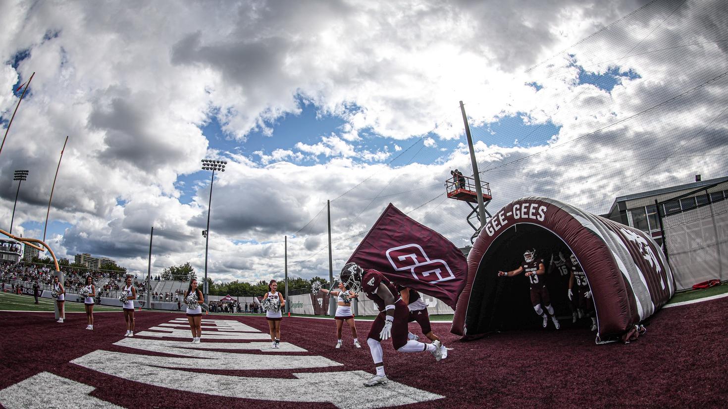 football team exiting tunnel