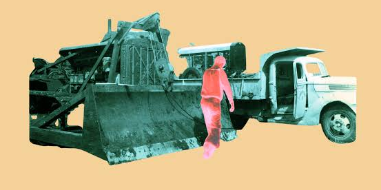 Old bulldozer and truck with the silhouette of a person