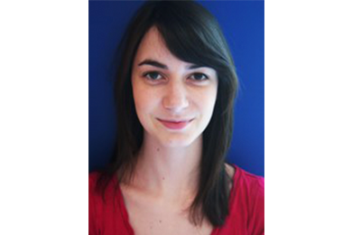 Faceshot of an employee with dark background
