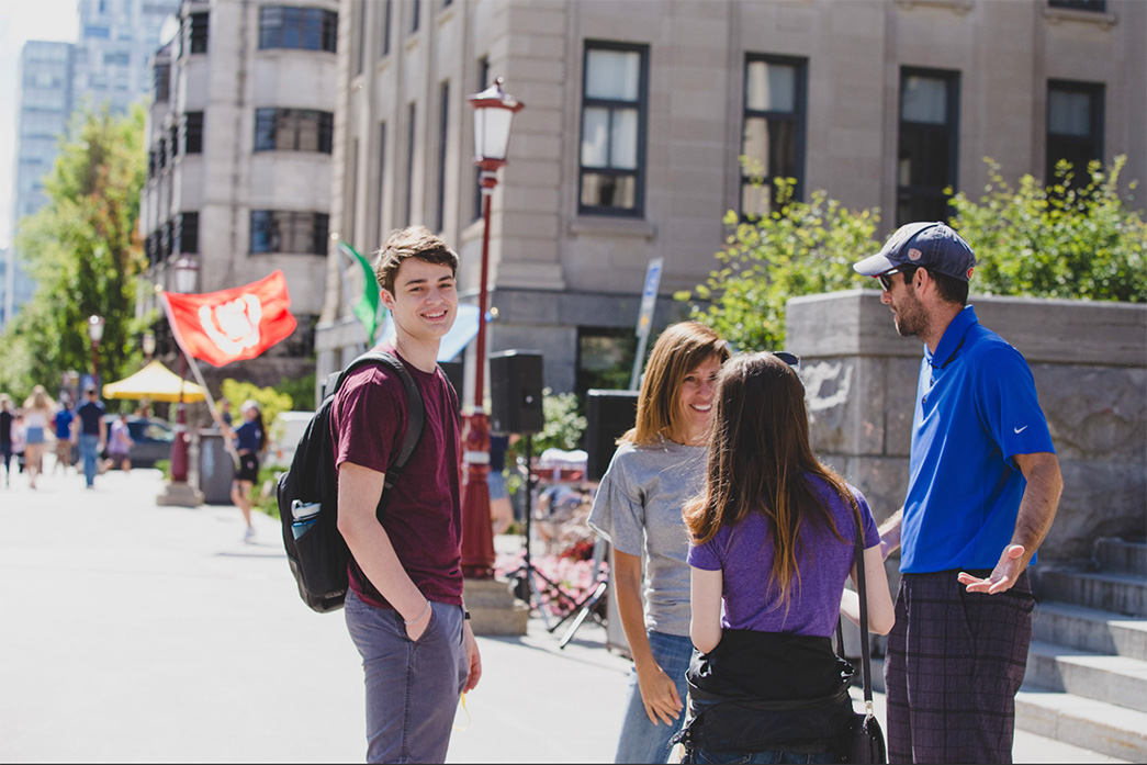 students standing outside on a sunny day