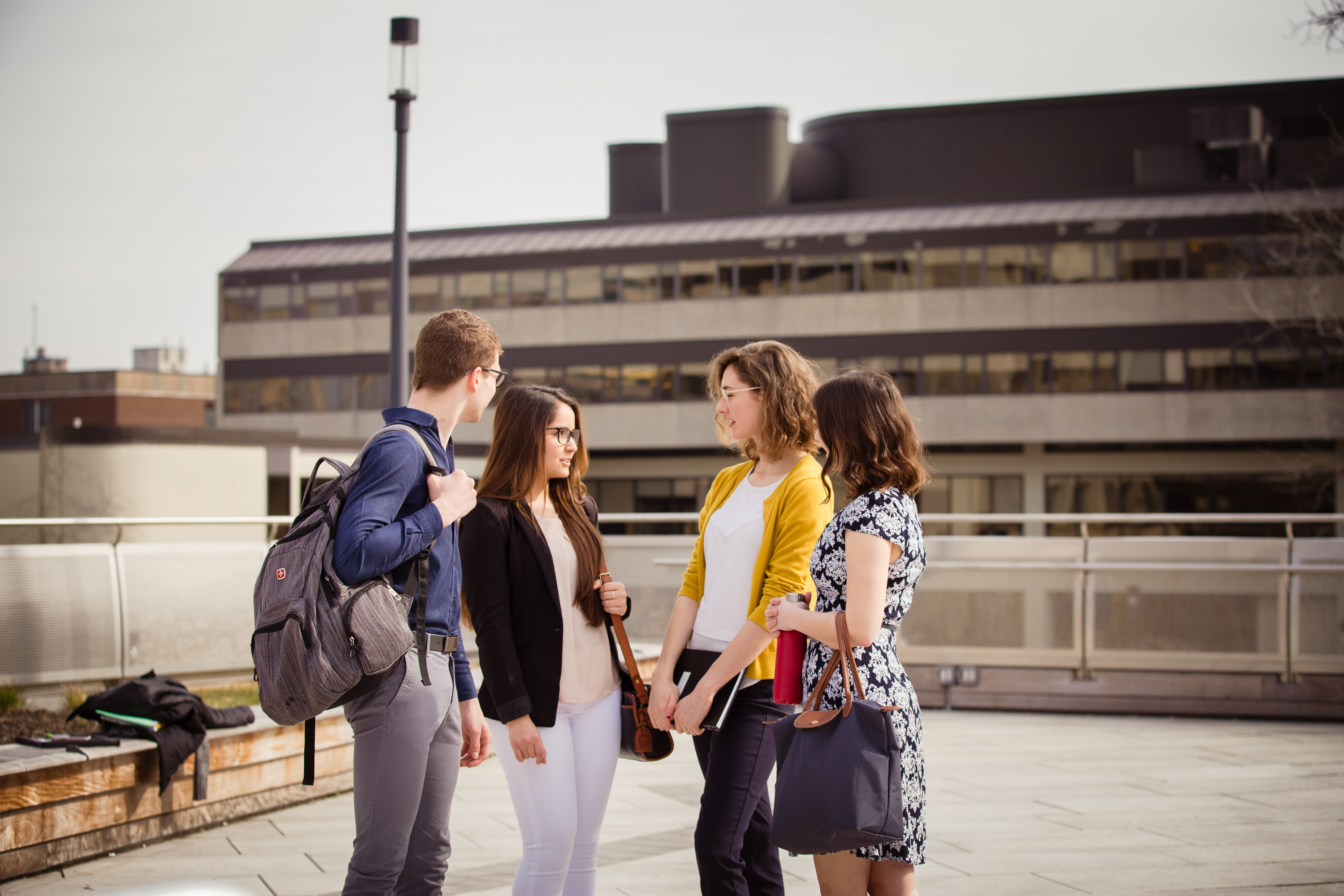 Students walking and talking on campus