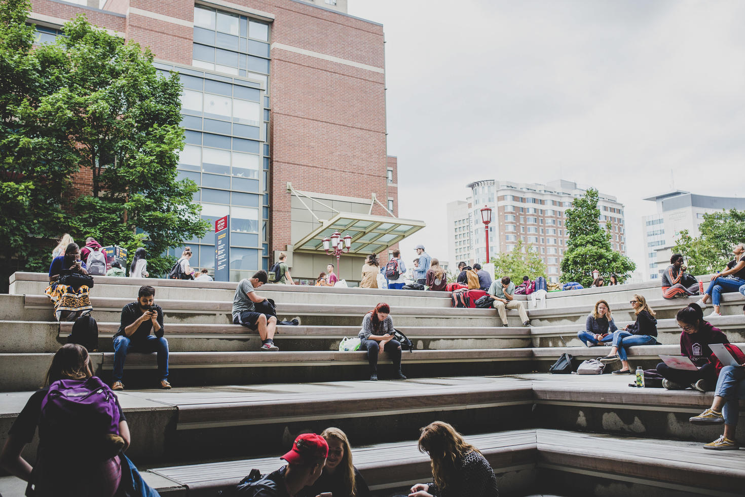 Crowd of students sitting on the steps of the Jock Turcot University Centre