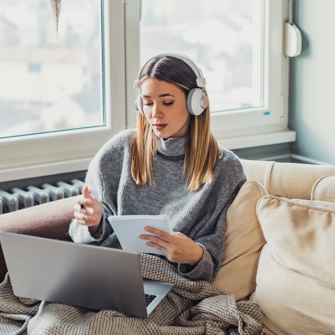 Student listening to virtual class on laptop