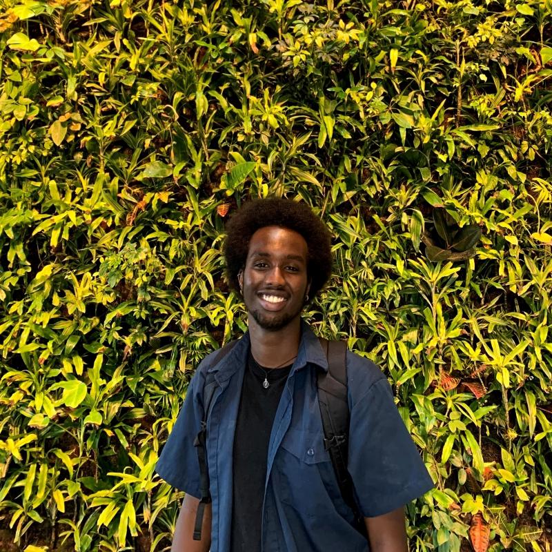 Jamal in front of the Plant Wall