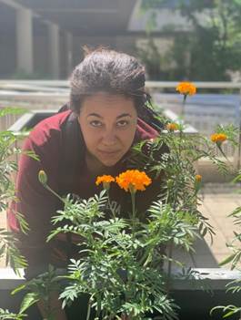 Victoria behind flowers