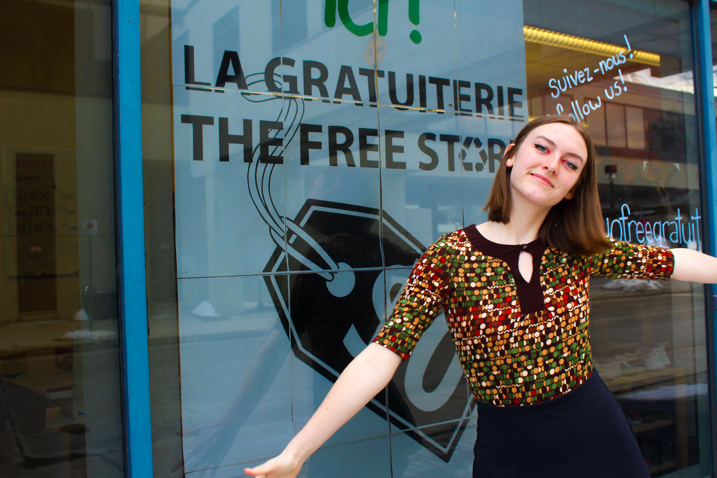 Woman standing in front of a store