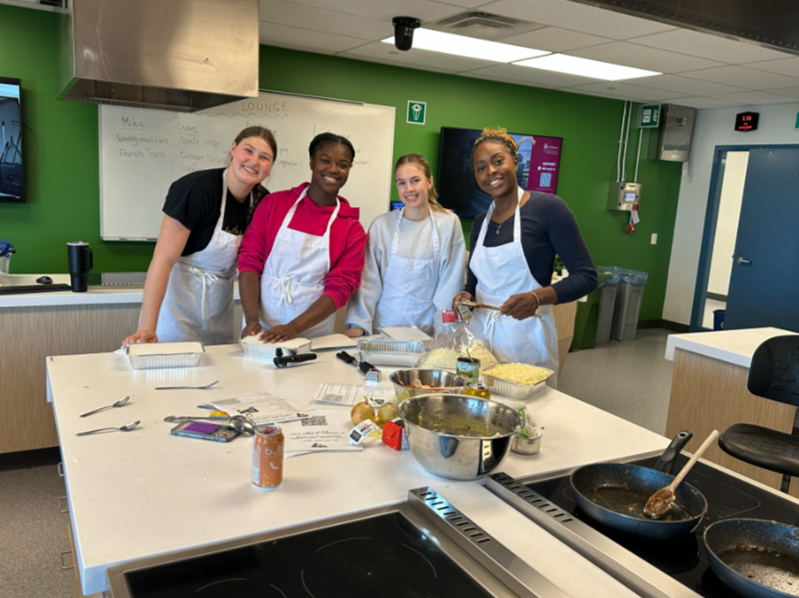 Student-Atheletes preparing food in the kitchen