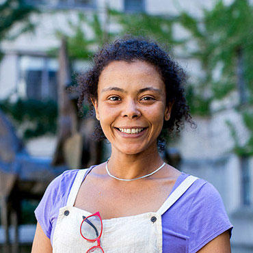 mature student looking at camera on campus