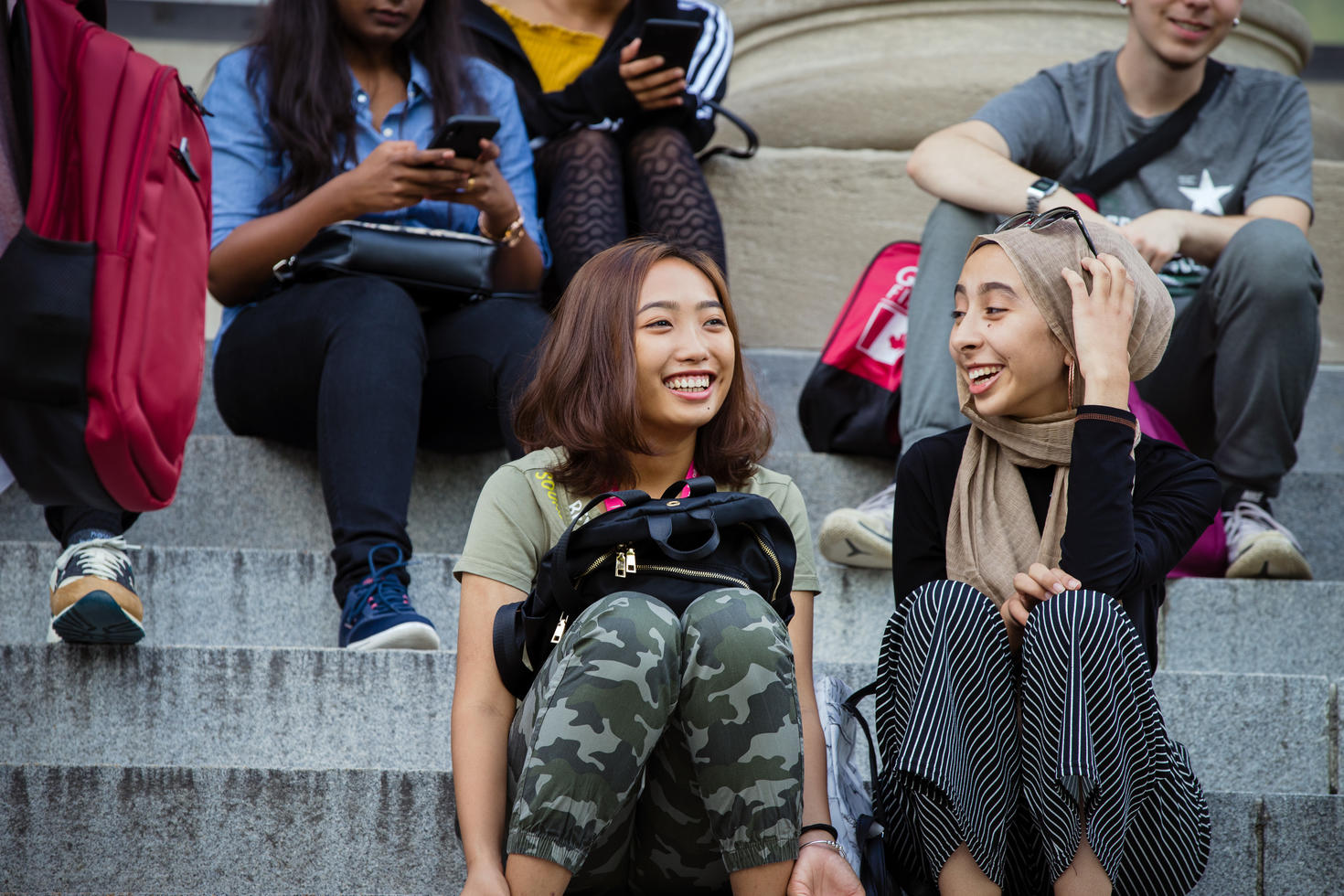 Two students on Tabaret hall steps
