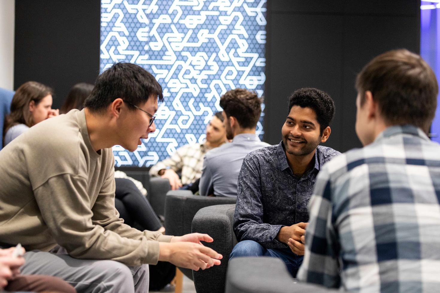 Graduate students talking during an event
