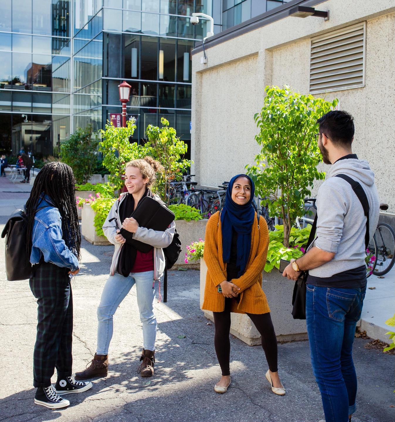 Four students talking on campus
