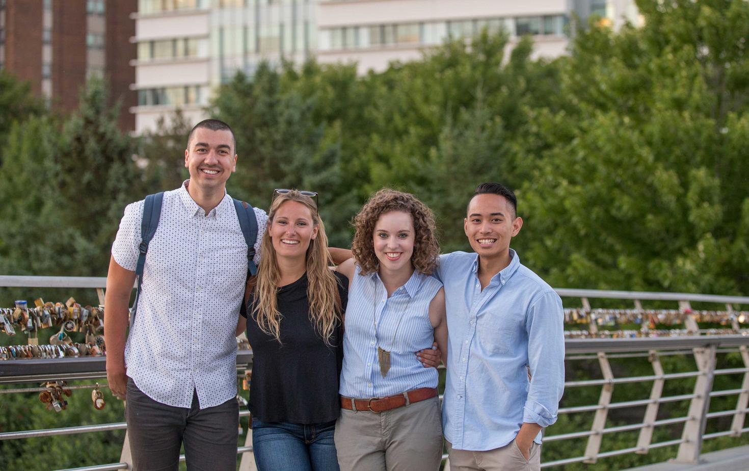 Four students smiling at the camera