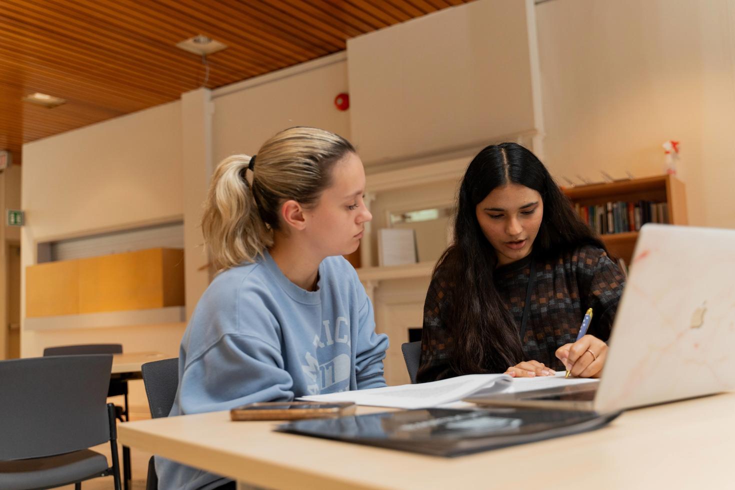 Students looking at computer