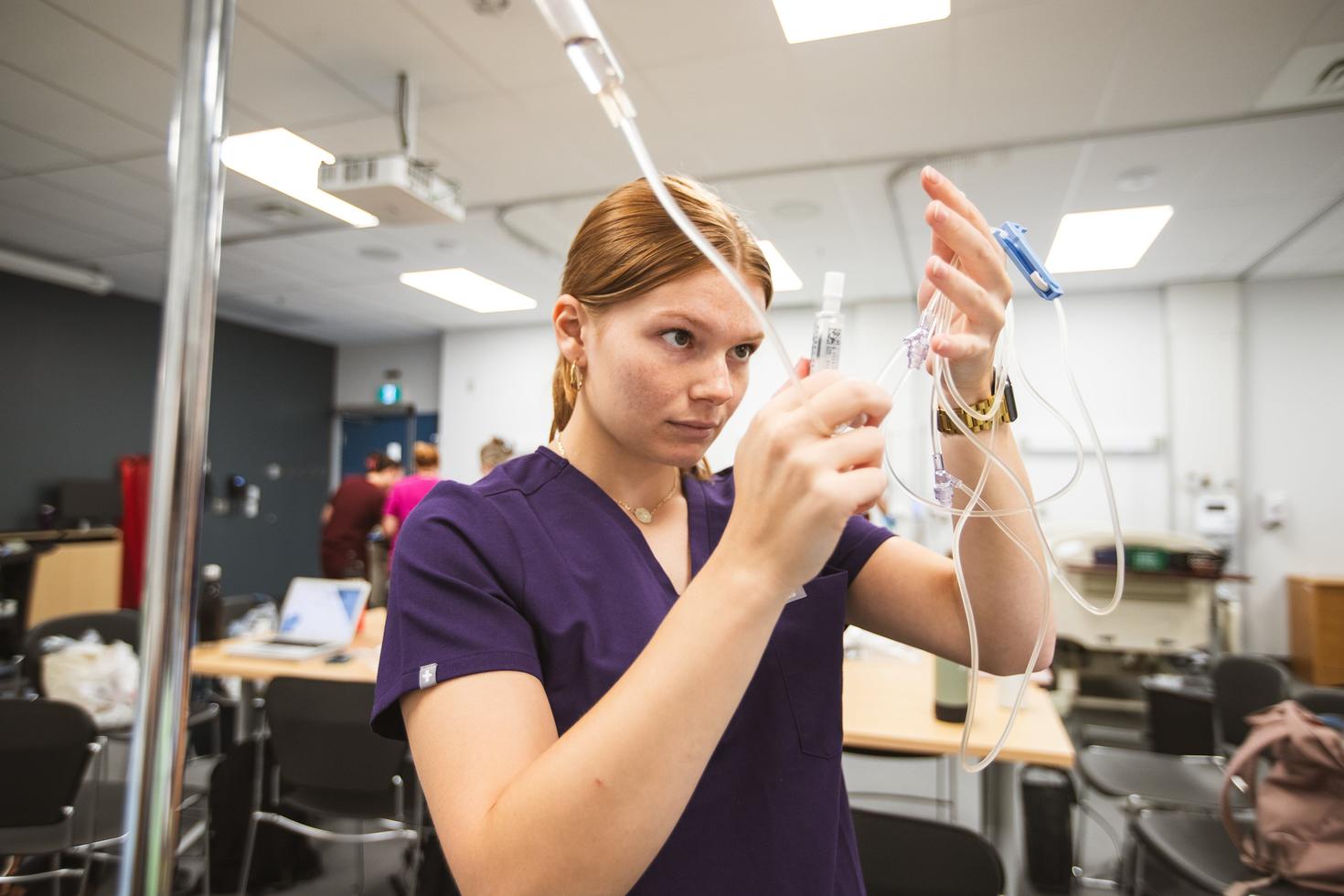 Student working with IV