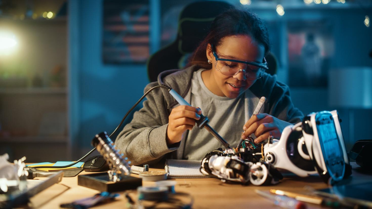 Student working on a robot in the lab