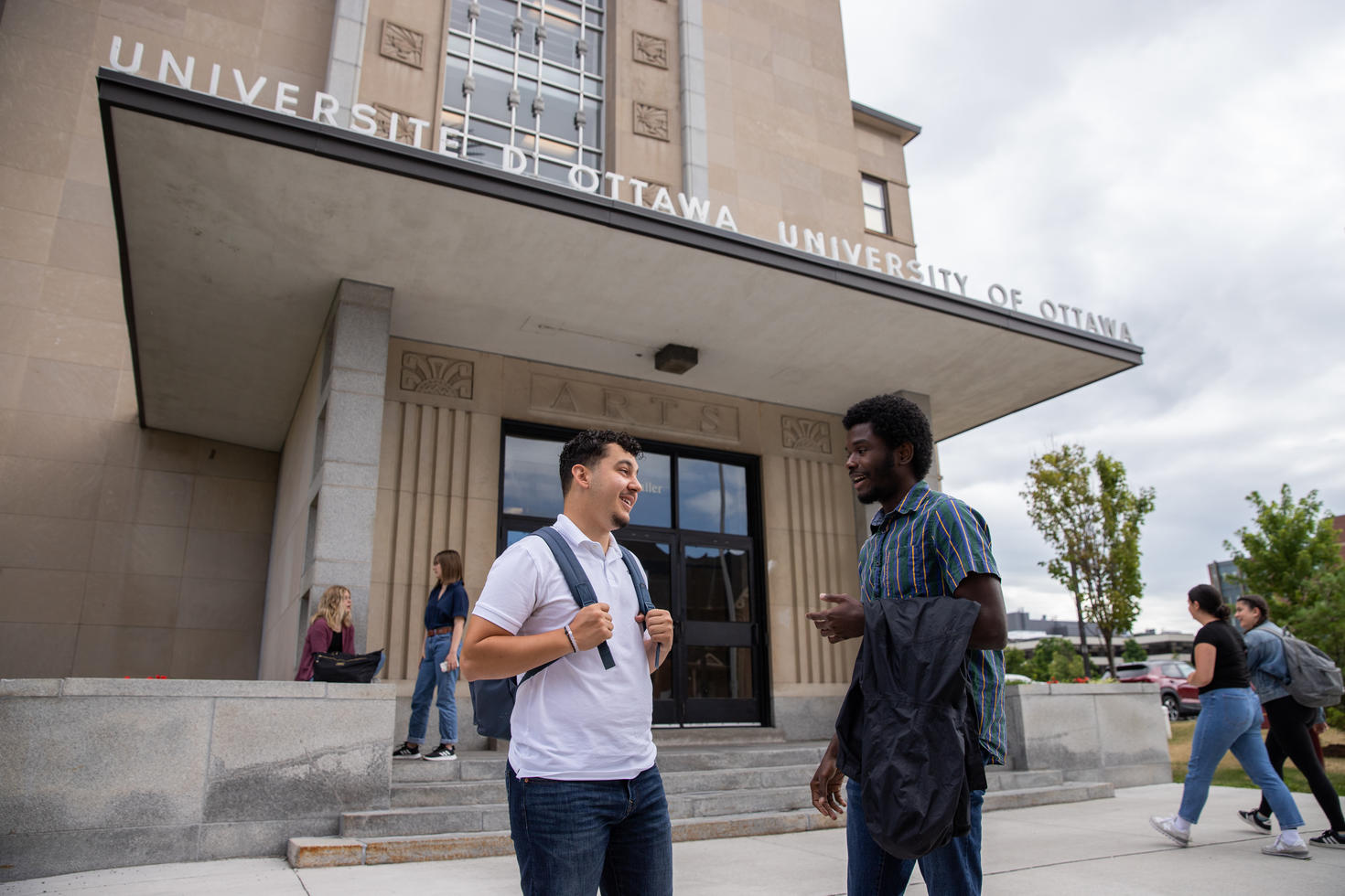 two students standing in front of Simard 
