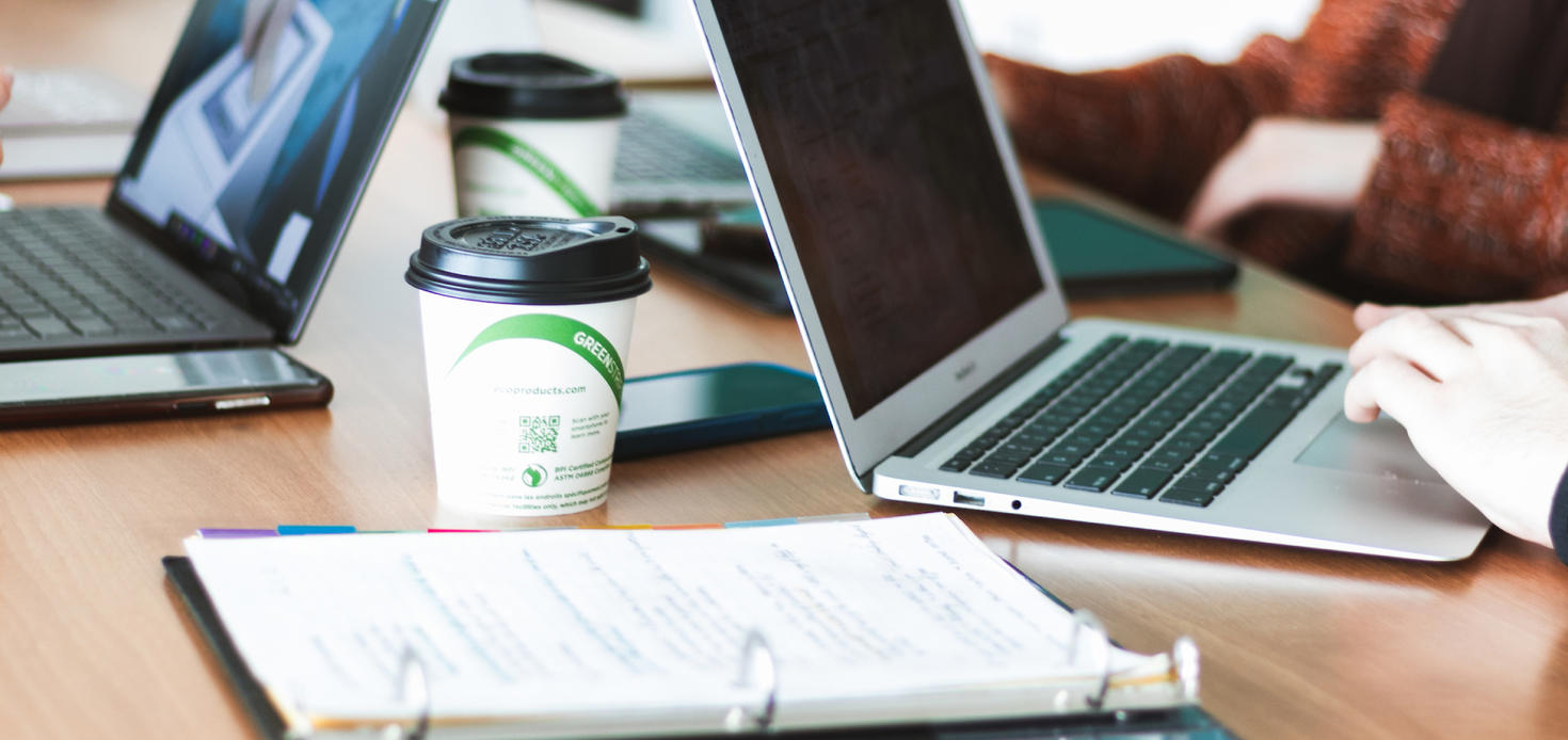 Laptops, notebooks and coffee cups