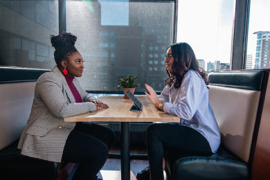 Two women sitting for an interview