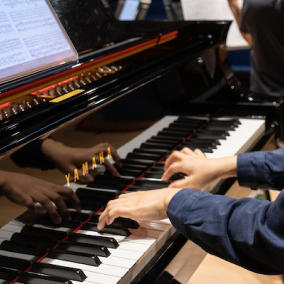 Student playing the piano