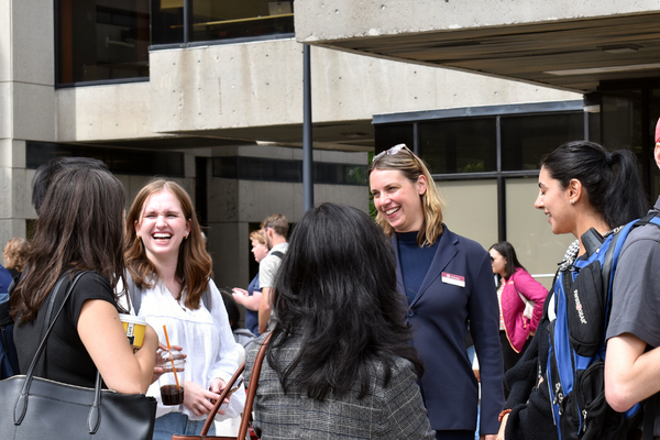 Dean talking with students