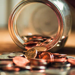 Jar with coins falling out