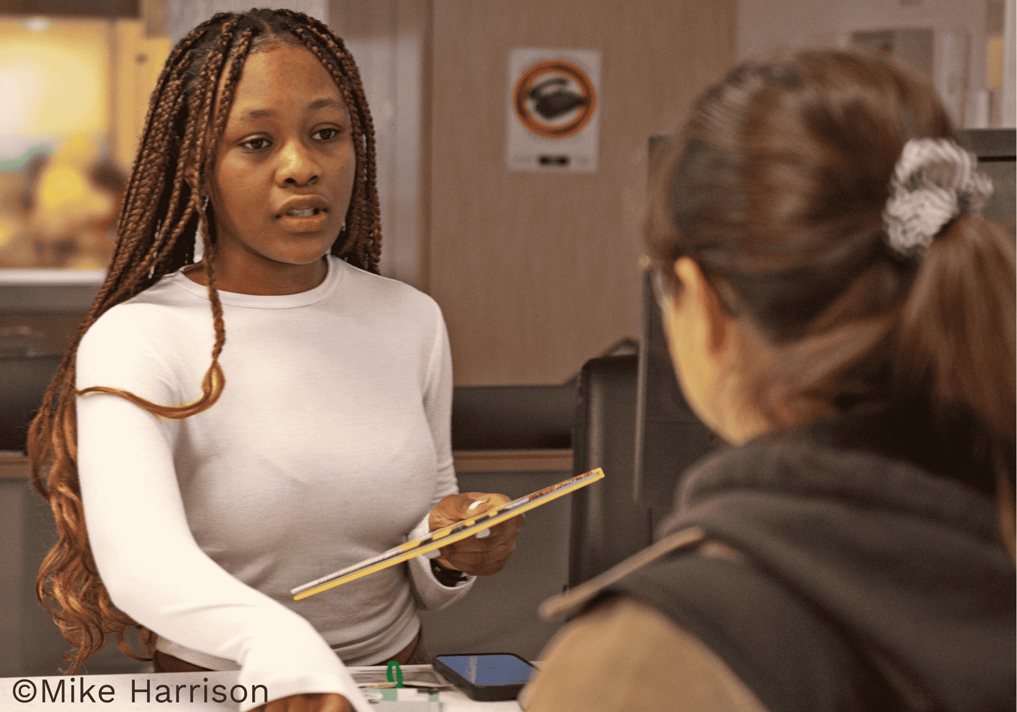 Receptionist helping a student at the resource center