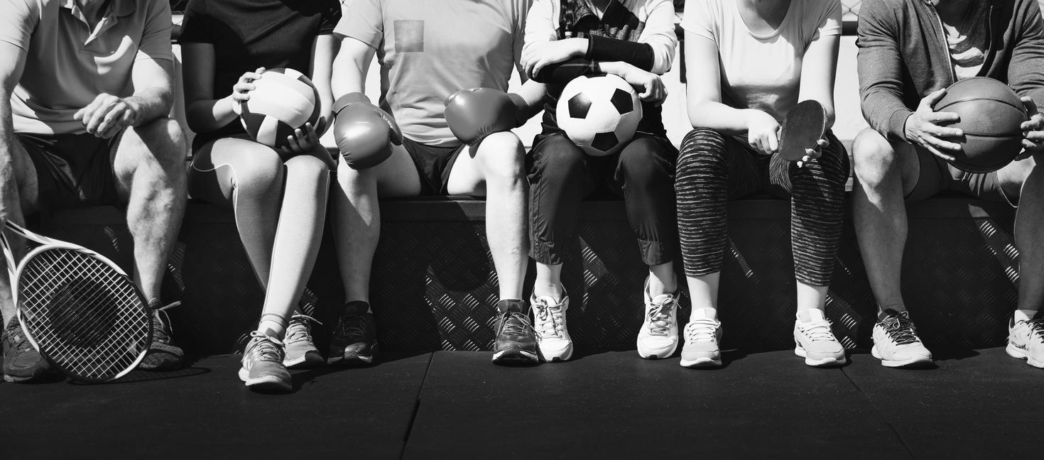 group of diverse athletes sitting together