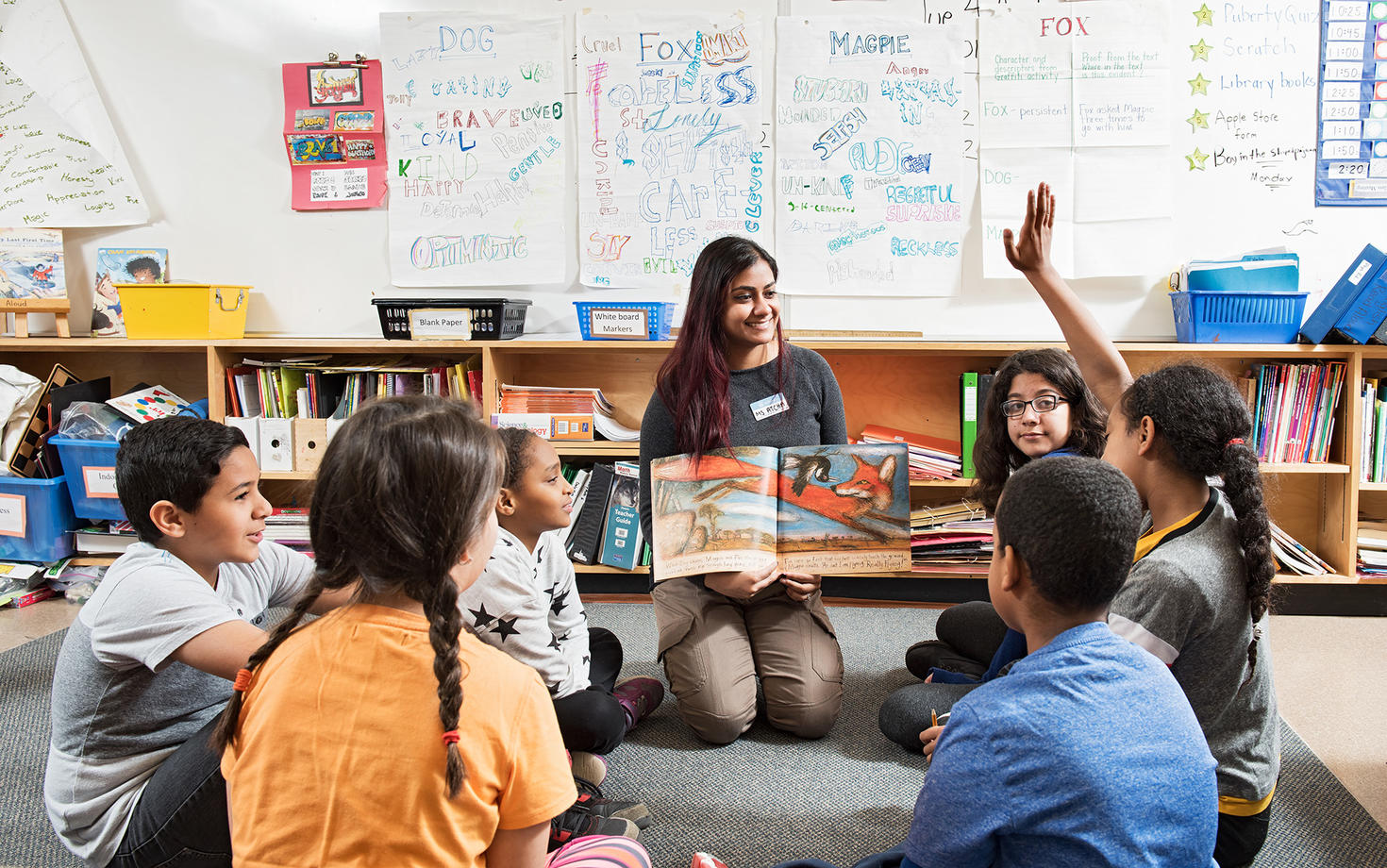 student teacher teaching a class to children