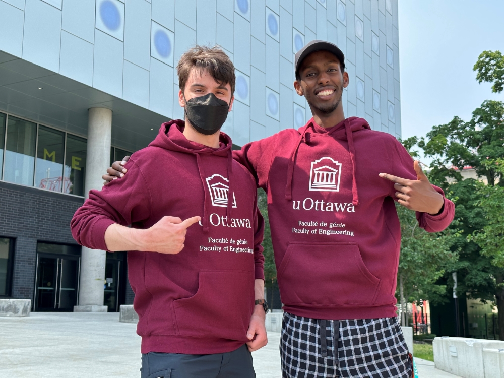 Two students wearing Faculty of Engineering hoodies.