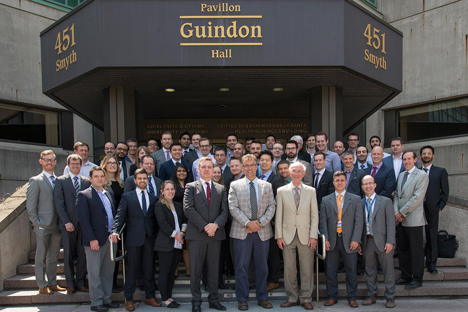 Dr. Uhthoff, poses with participants of the 2016 Hans K. Uhthoff Research Day on the front steps of the Faculty of Medicine’s Roger Guindon