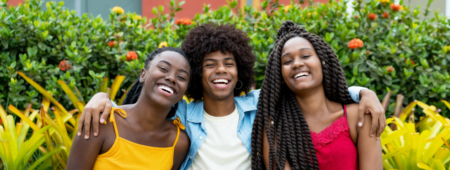 three students laughing together