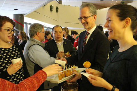 Dean Bradwejn serving up hors d’oeuvres to guests.