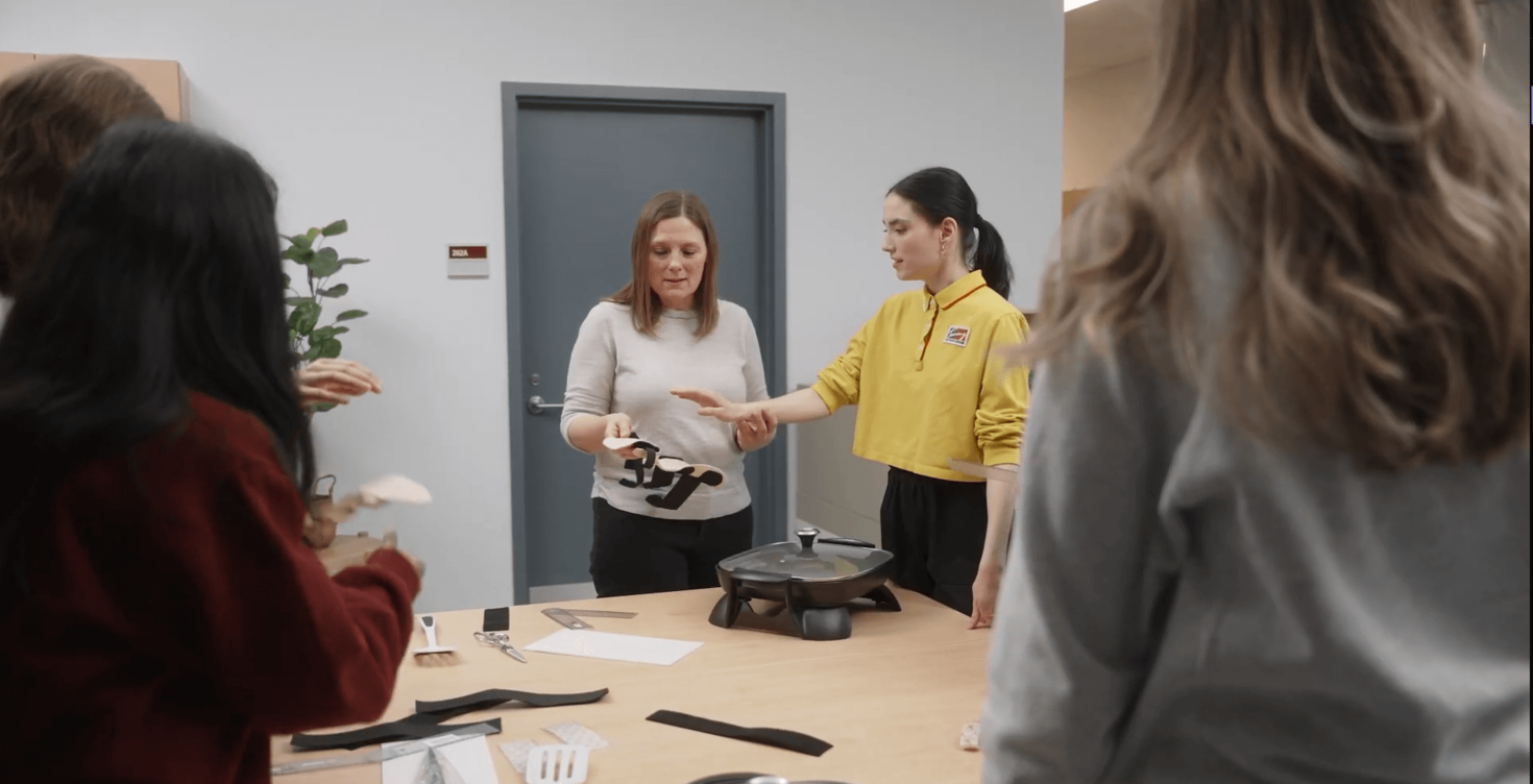 students with professor in a lab