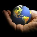 hand holding small Earth Globe