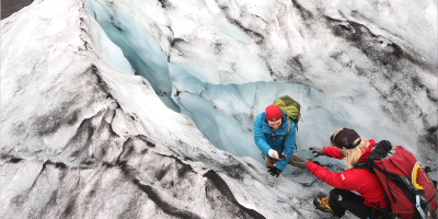 Hikers climbing an ice mountain.