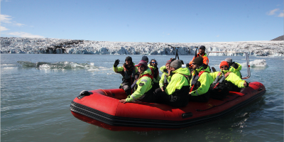 Students in a raft on water.