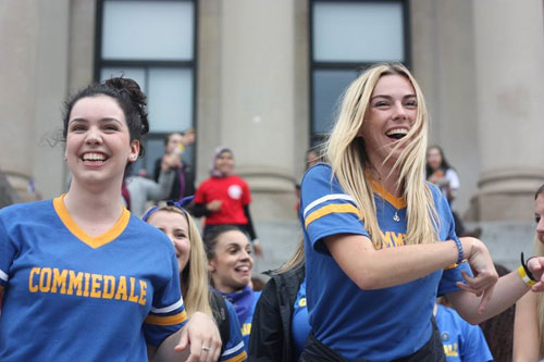 Students celebrating outside of Tabaret Hall.