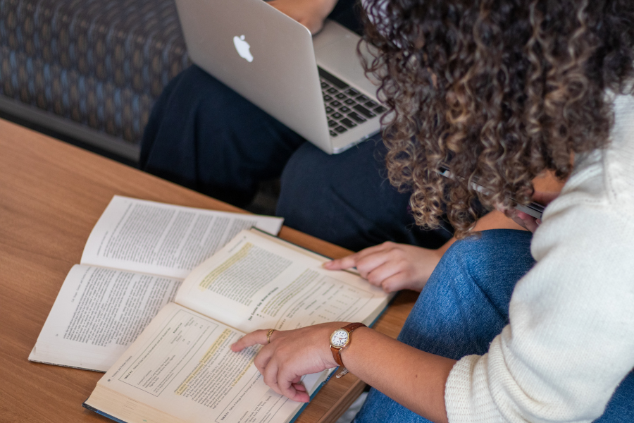 Student reviewing material from a textbook