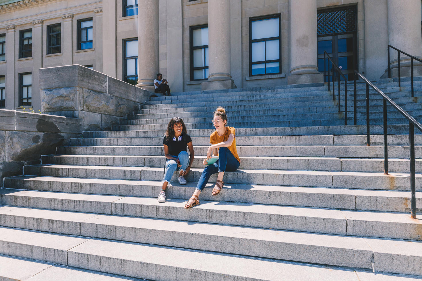students sitting on the steps of Tabaret