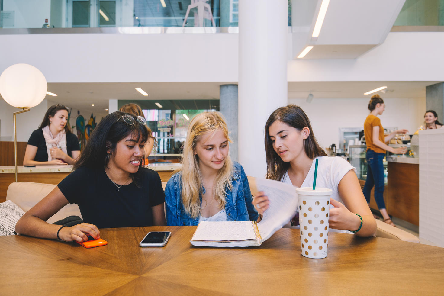 Students at a table and chatting