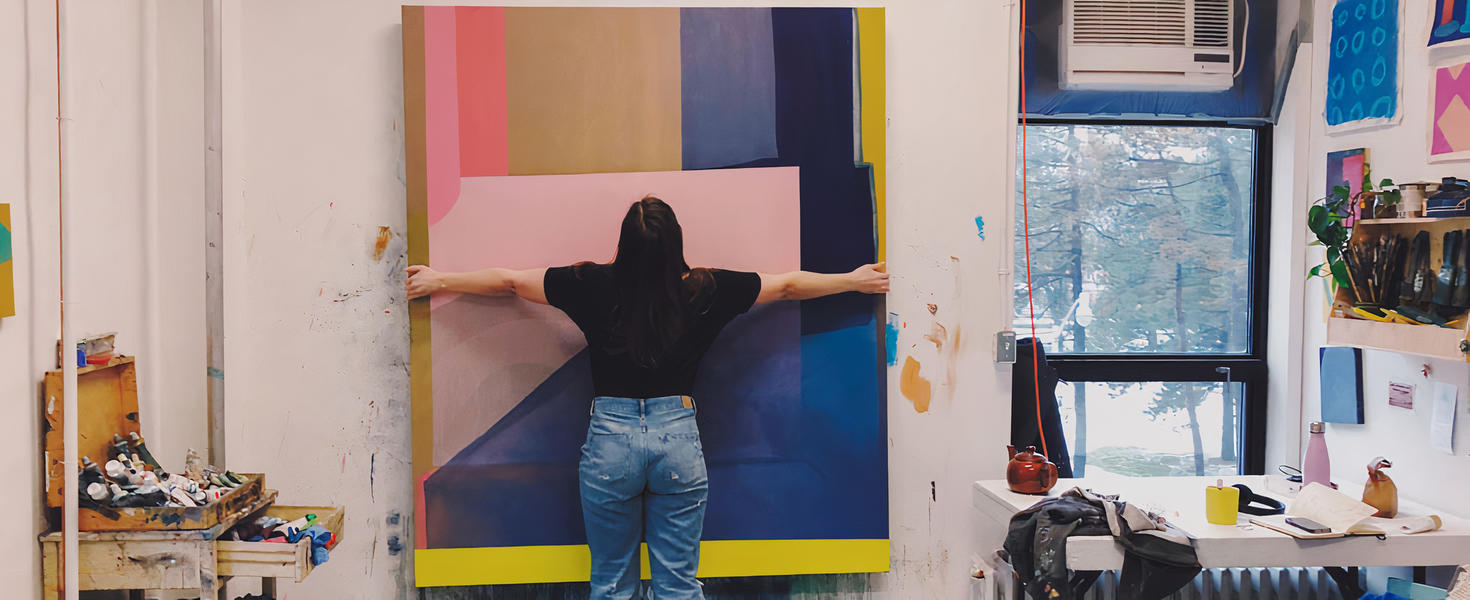 artist holding canvas