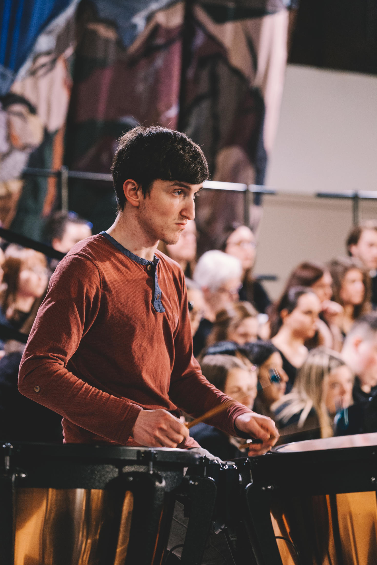 A student playing the drums