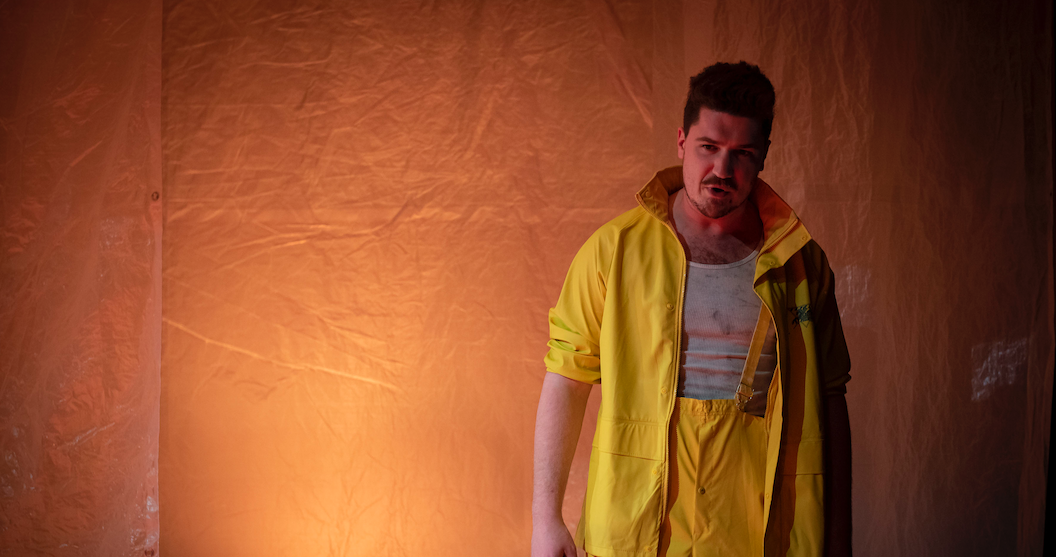 Actor in yellow pants and jacket.