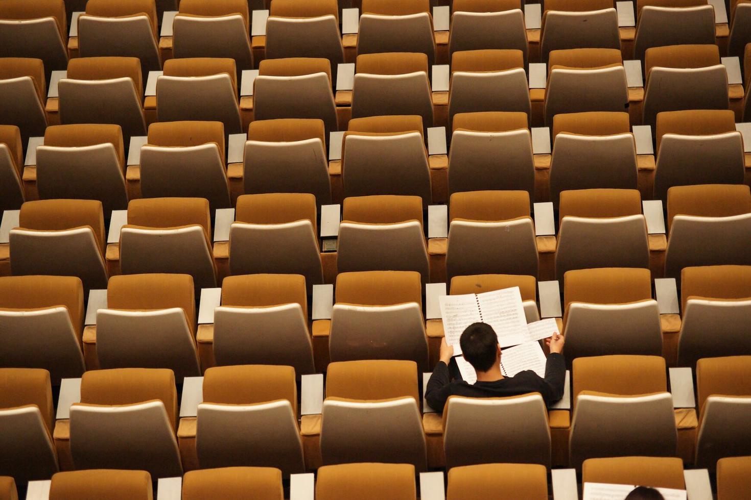 Person studying in an auditorium 