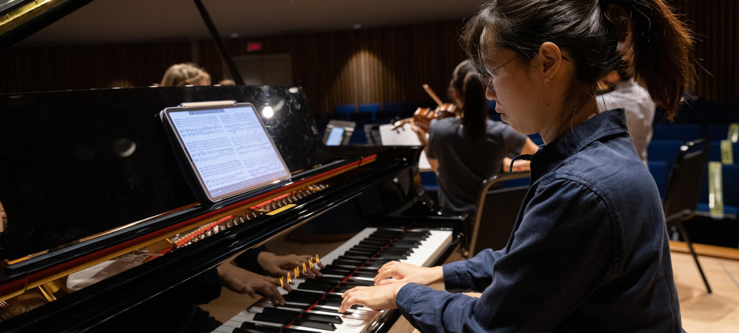A student playing piano