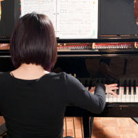 A student playing the piano
