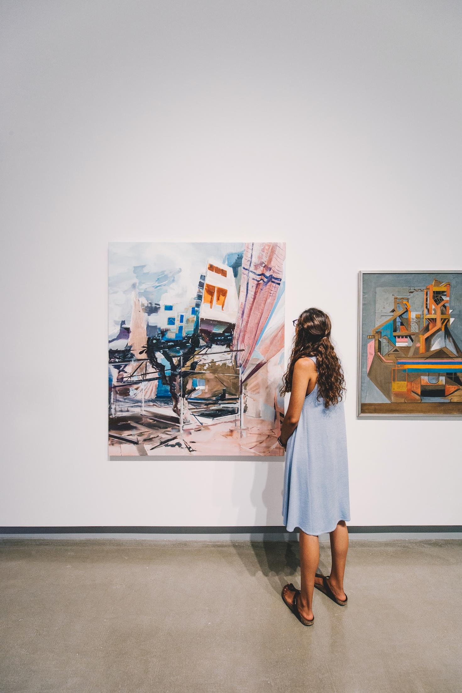 A person looking at a work of art