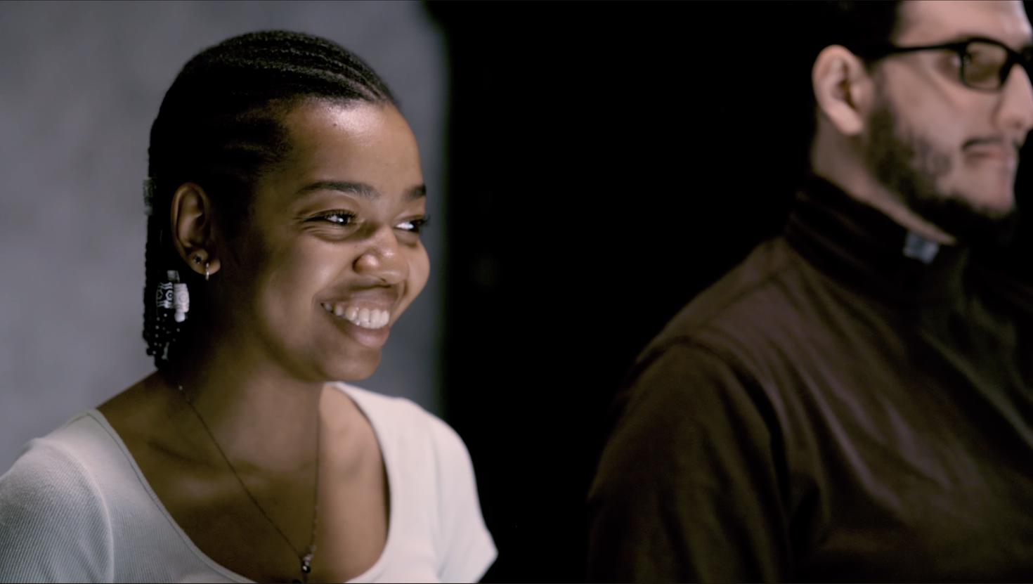 Screen capture of woman from the video