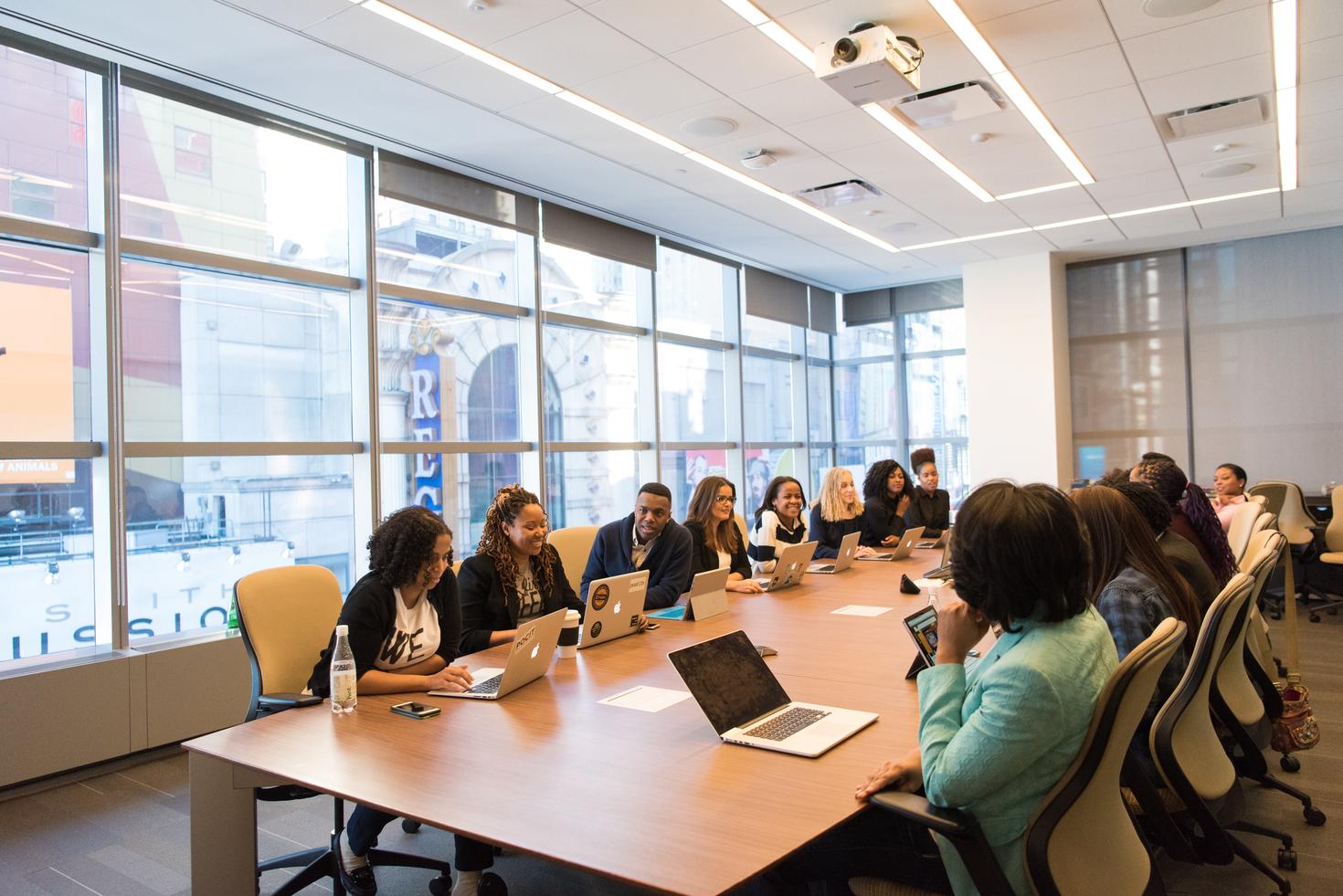 Group of person sitting at a table during a meeting